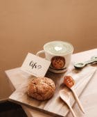 franchisees for life. white ceramic mug beside brown cookies on brown wooden chopping board