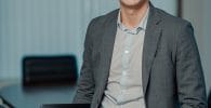 entrepreneur, man in gray suit jacket smiling