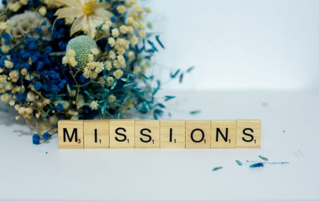 Investors buy missions, not ideas 2014 1 missions, a scrabble type block spelling the word miss, sits next to a bouquet