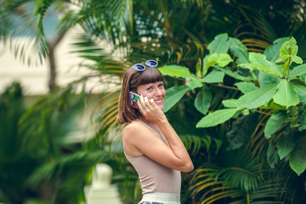 Tourism and Internet 1 Tourism and Internet woman in white tank top and blue sunglasses