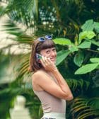 Tourism and Internet woman in white tank top and blue sunglasses