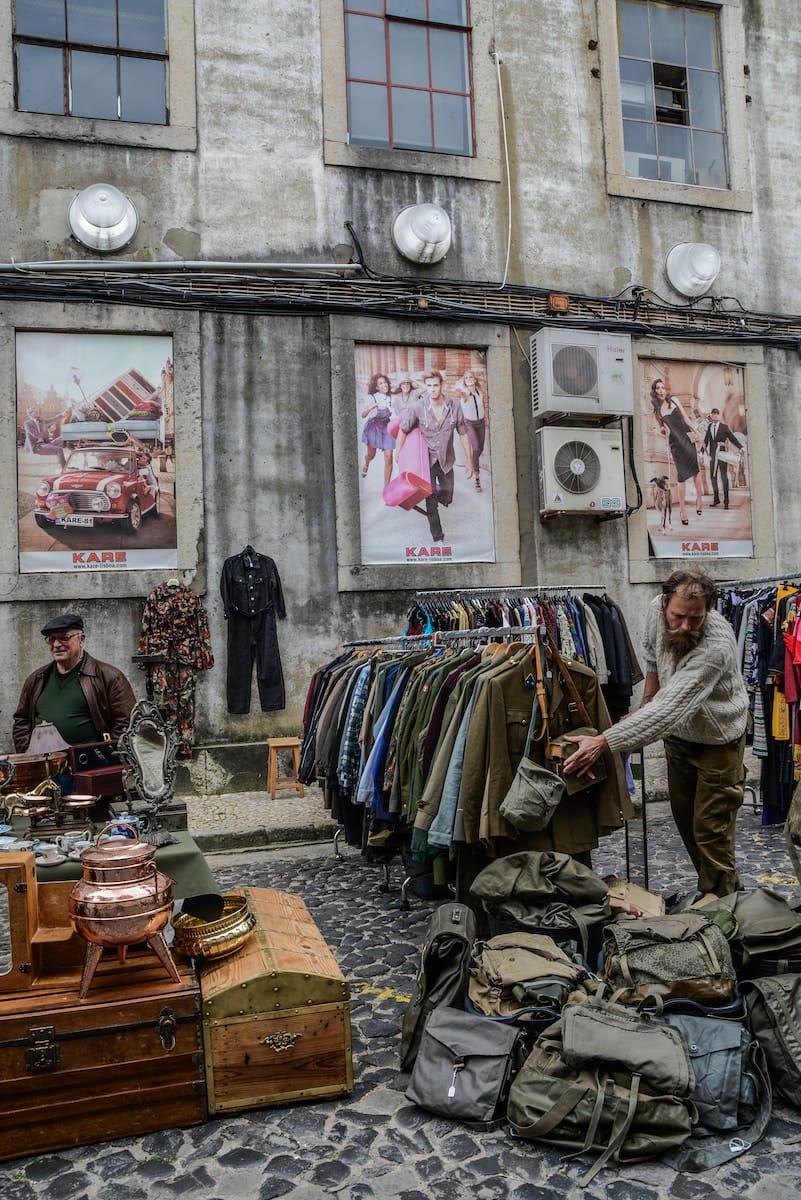 Trade fairs as a commercial opening (1999) and after... 2 Trade fairs clothes and bags displayed on road near building during daytime