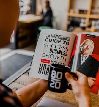 Profitable Franchises man reading magazine. Profitable franchising is one of the things any franchisee wants to achieve, but there are several things you need to keep in mind.