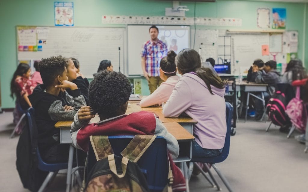 Bill Gates: Teachers need feedback 1 Teachers, man and woman sitting on chairs
